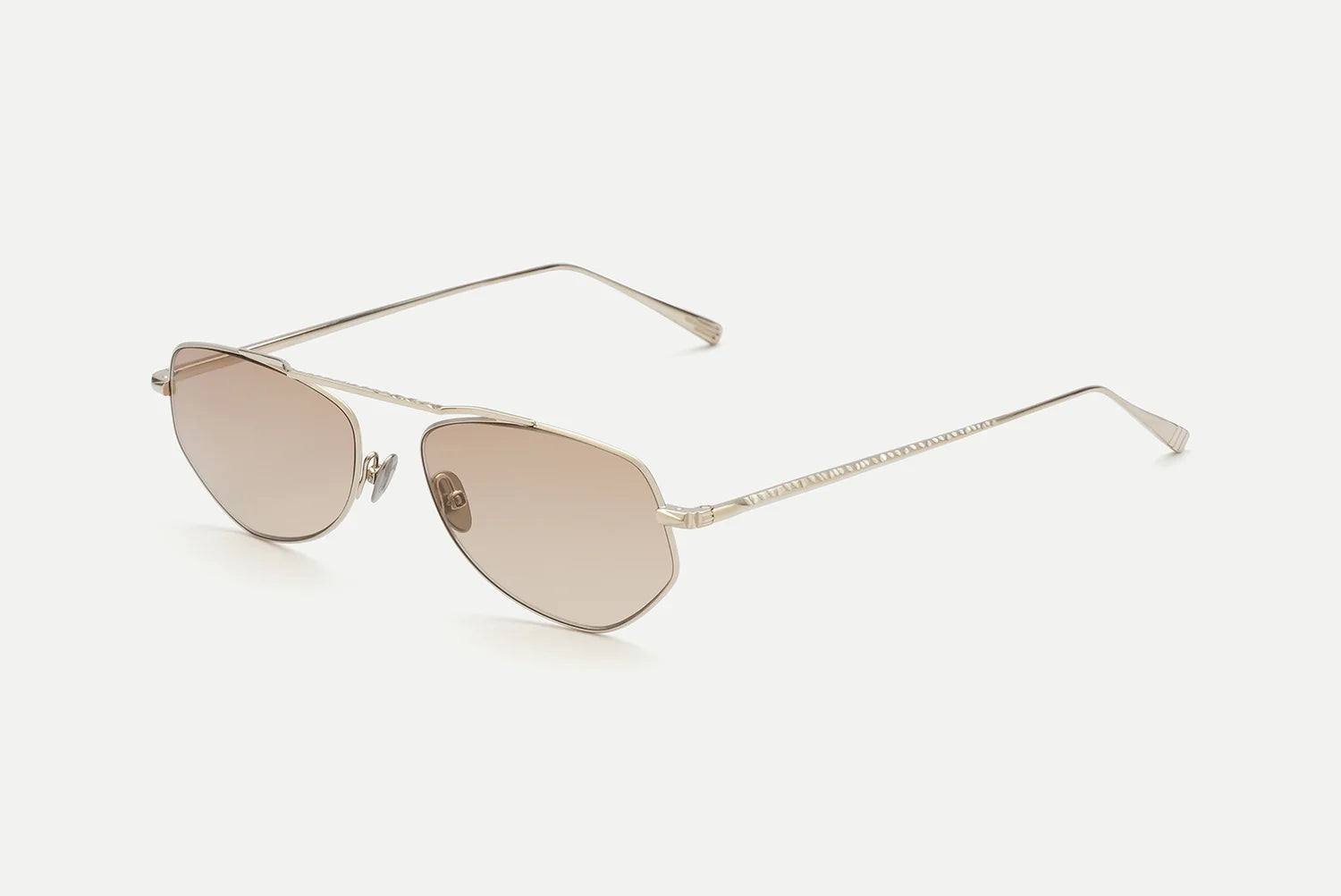 The AHLEM Julien aviator sunglasses by AHLEM feature a thin 22k gold frame and slim arms, light brown-tinted lenses, and are handcrafted in France. Displayed on a plain white background.