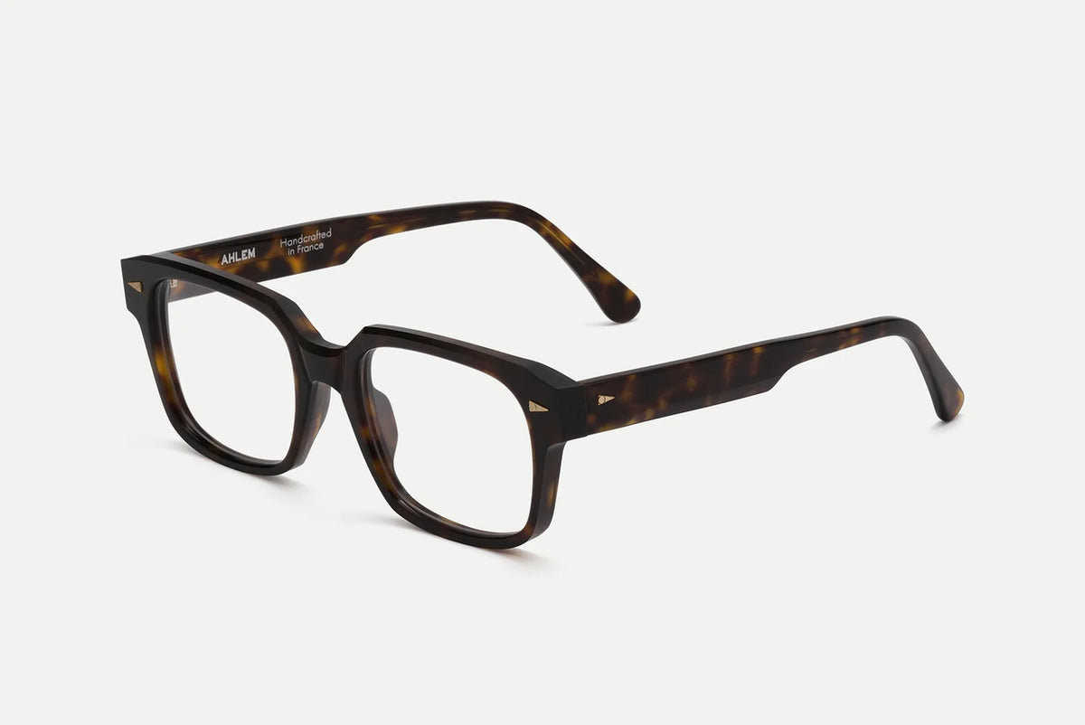 AHLEM Gros Caillou handcrafted French tortoiseshell rectangular eyeglasses with gold-tone accents at the temples.