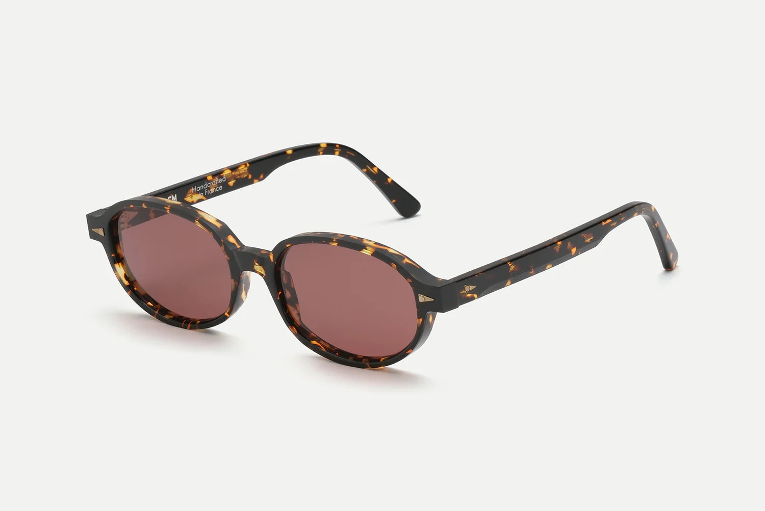 AHLEM Rohan round sunglasses in tortoiseshell with brown lenses, handcrafted in France from premium Italian acetate by AHLEM, shown on a white background.