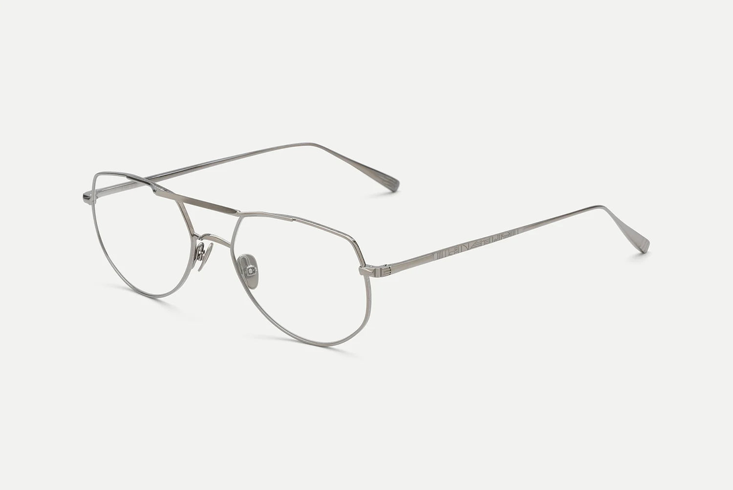 The AHLEM Cadet by AHLEM is a pair of silver metal aviator-style eyeglasses, handcrafted in France with thin frames, clear lenses, and straight temples, set against a plain white background.
