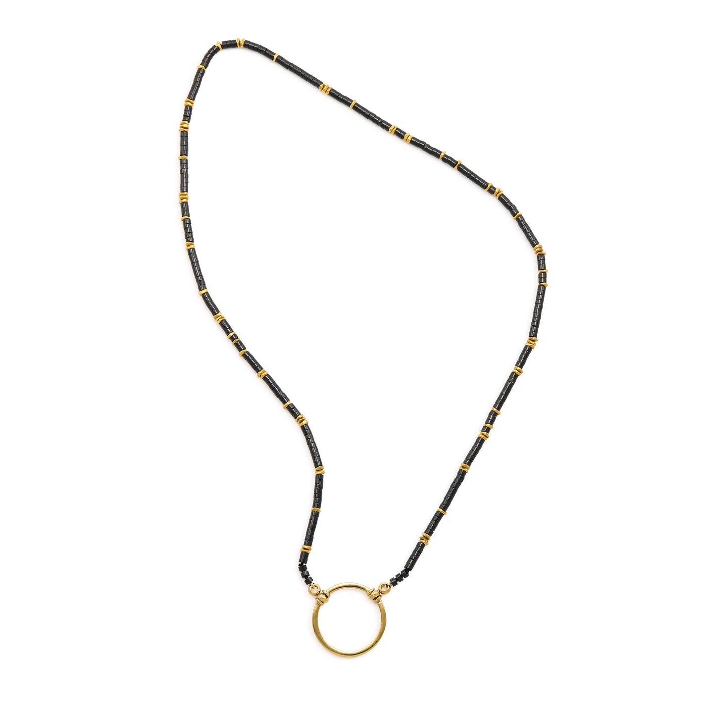 Black beaded necklace with a gold circular pendant on a white background