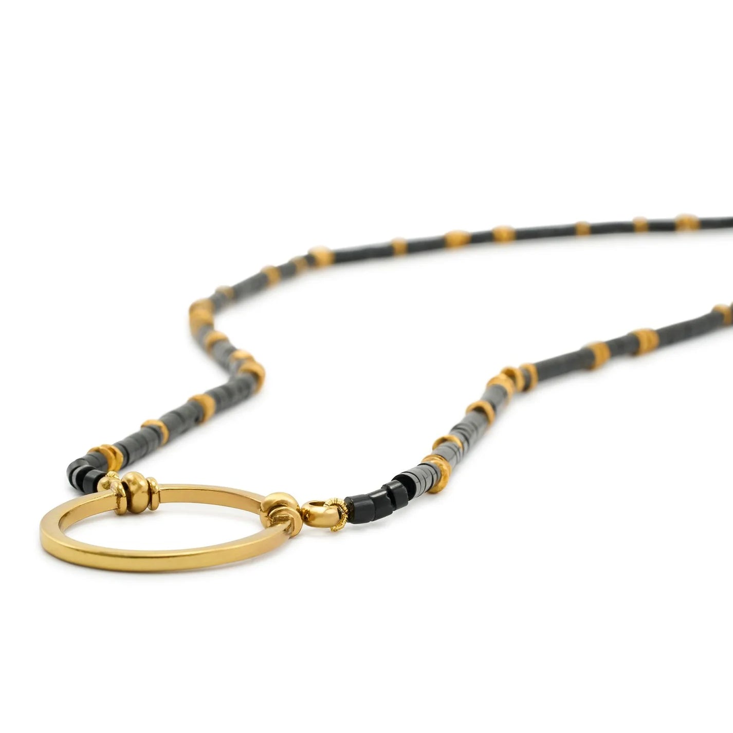 Necklace with gold clasp and black and gray beads on a white background