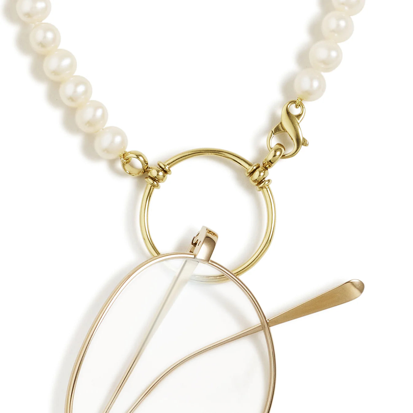 Pearl necklace with a gold leaf-shaped pendant on a white background
